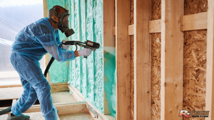 Man installing spray foam insulation